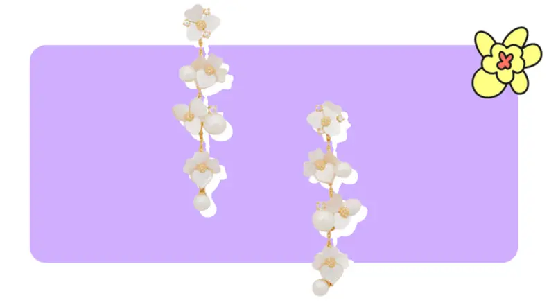 A pair of Precious Pansy Statement Linear floral drop earrings from Kate Spade in front of purple background with a yellow cartoon flower in the corner.