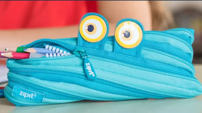 Blue monster-themed zipper pencil case.
