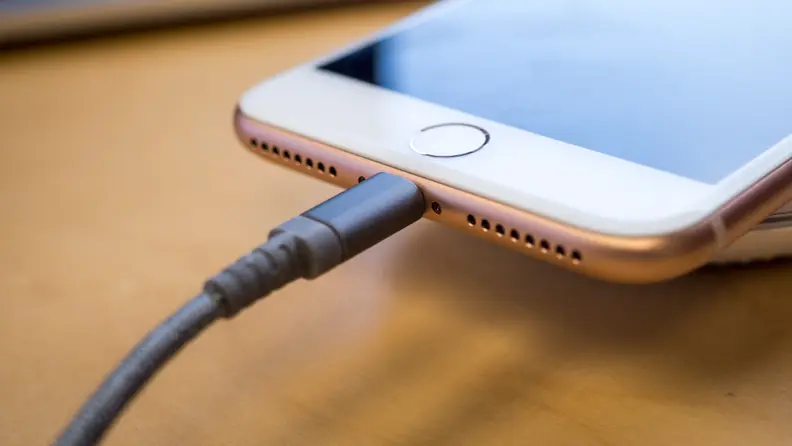 A Lightning Cable Attached to an iPhone