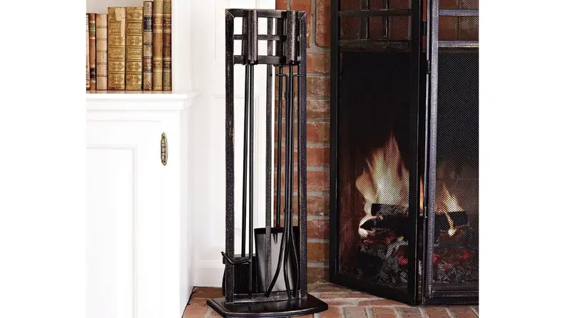 Handsome hearth tools next to a roaring fire