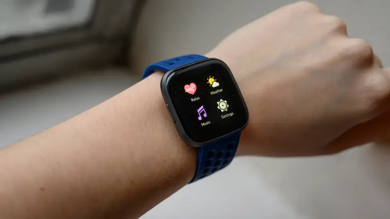 an extended wrist with a fitbit tracker