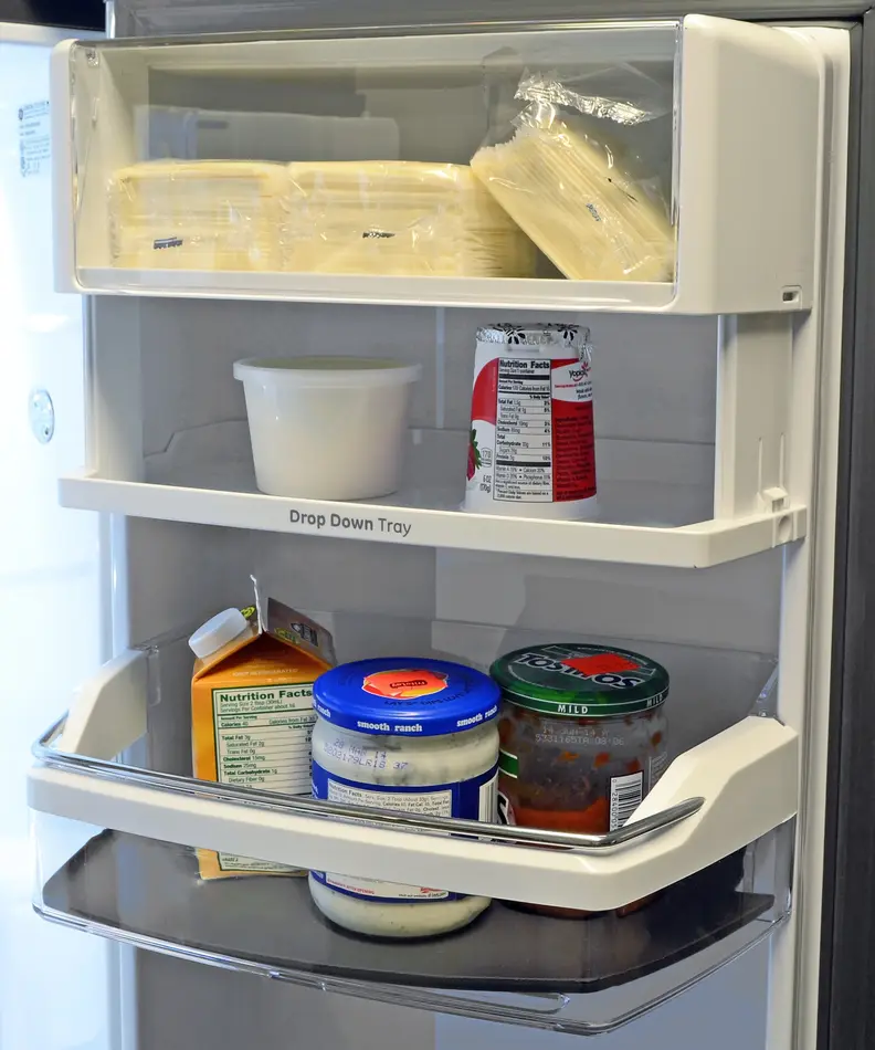 The GE Cafe CFE28TSHSS's drop down tray is great if you plan to store a lot of shorter items on the door.