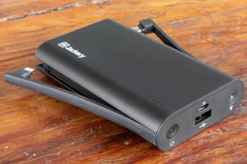 the jackery powerbank sits on a wood table