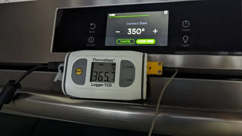 A ThermaData temperature reader attached to the oven door of the Frigidaire Gallery GCFI3060BF 30" Induction Range.