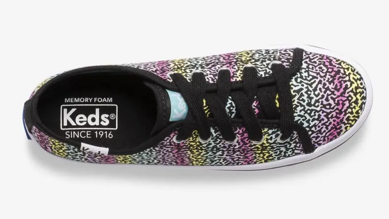 A colorful leopard print Keds shoe.