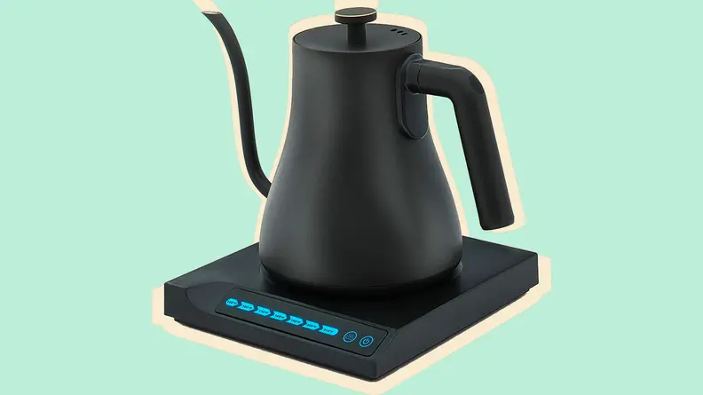 Electric kettle on a green background