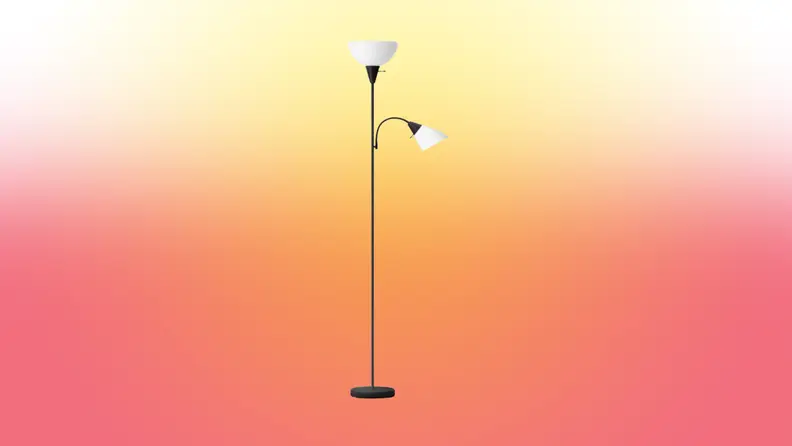 A lamp stands on a red and yellow fade background