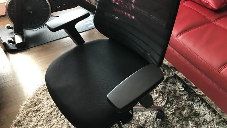 A close up of the armrests and seat on the Branch Ergonomic Chair