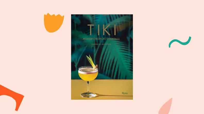 Tiki cookbook against a light pink background.