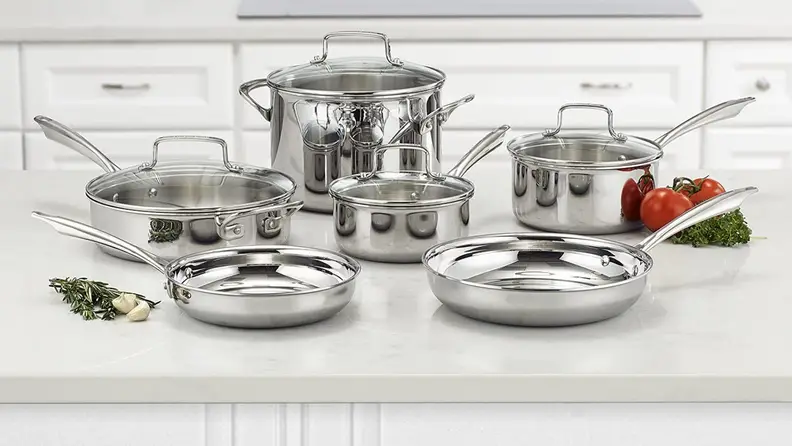 Silver cooking set on countertop in kitchen.