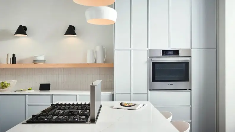 Bosch HBL8454UC oven in modern kitchen setting.