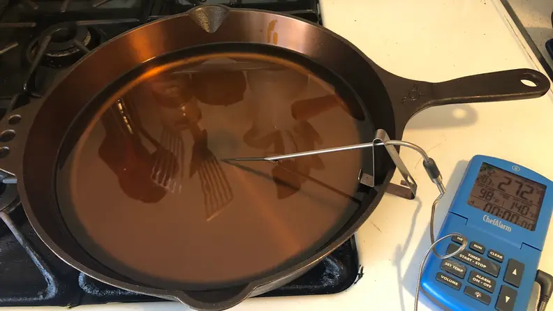 Heating oil to prep for fried chicken testing.