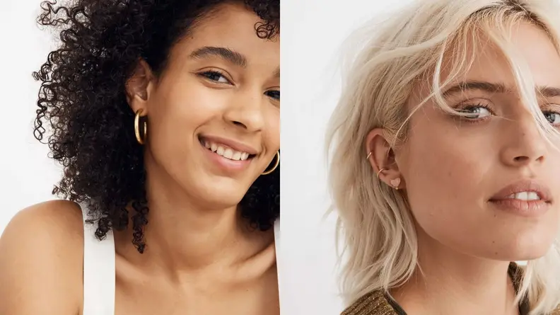 On the left, a model with dark curly hair shows off large, hoop-shaped earrings. On the right, a model with blond hair shows off several smaller earrings.