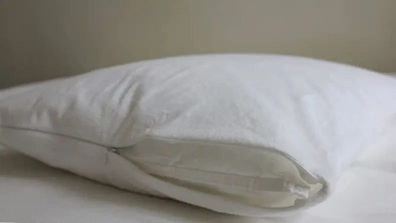 a terry pillow protector on a white surface