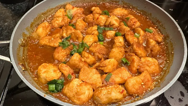 A pan filled with Savory Spice's Kung Pao Chicken blend.