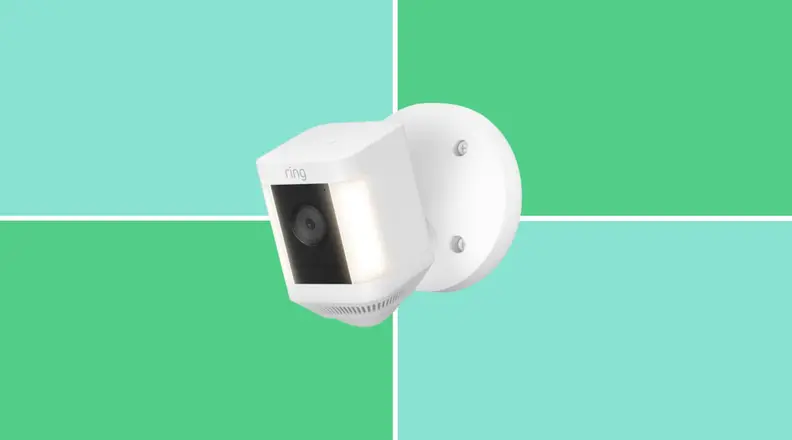 The Ring Spotlight Cam on a green and blue background.