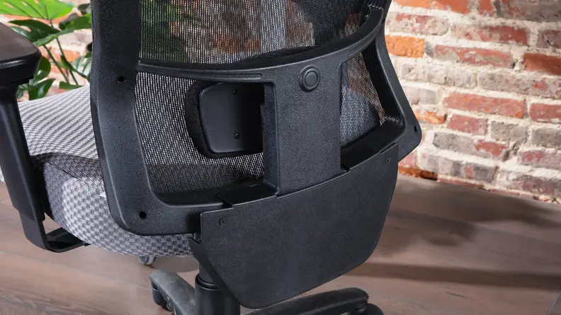 Close-up shot of the lower lumbar support on the Tempur-Pedic office chair.