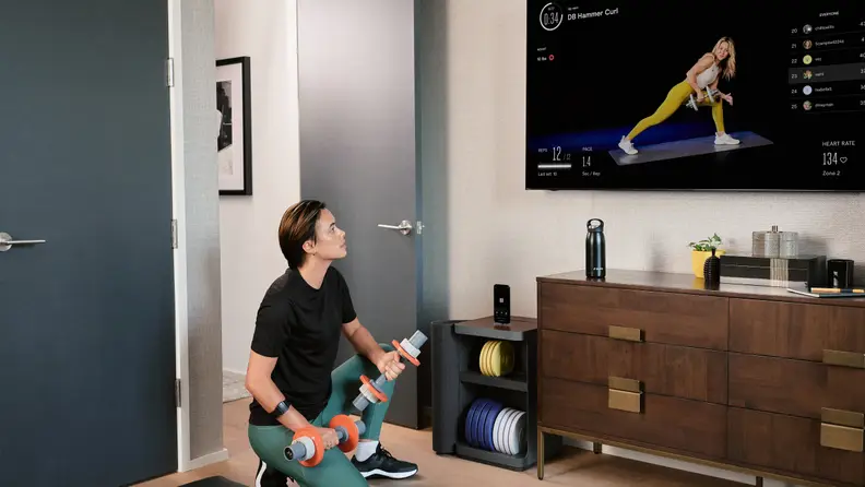 A person watching the instructor on the Tempo Move.