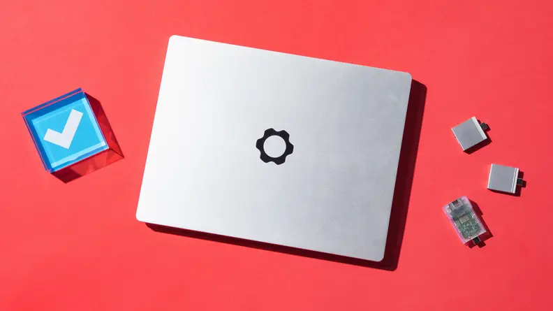 The closed laptop with the Frameworks logo and the swappable parts.