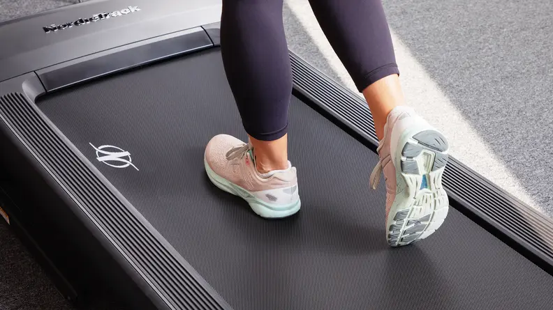 A woman's feet as she walks on the NordicTrack Commercial 1750.
