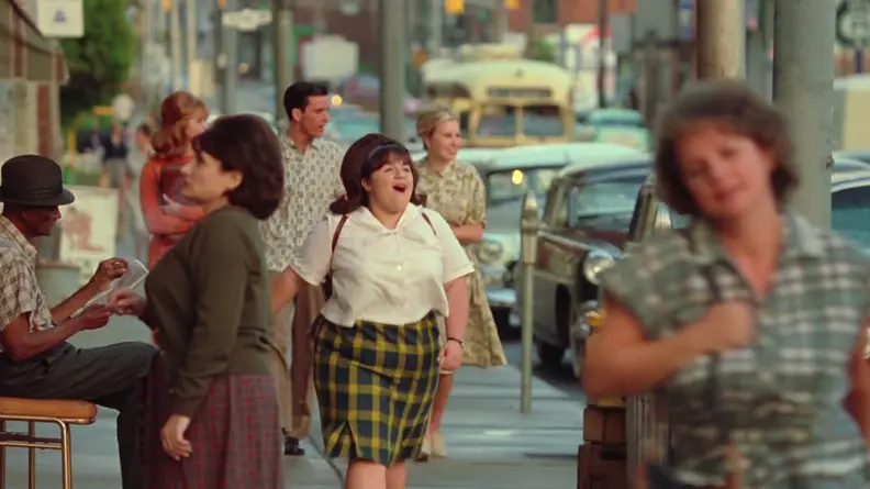 Tracy (Nikki Blonsky) singing as she walks through the streets of Baltimore, Maryland.