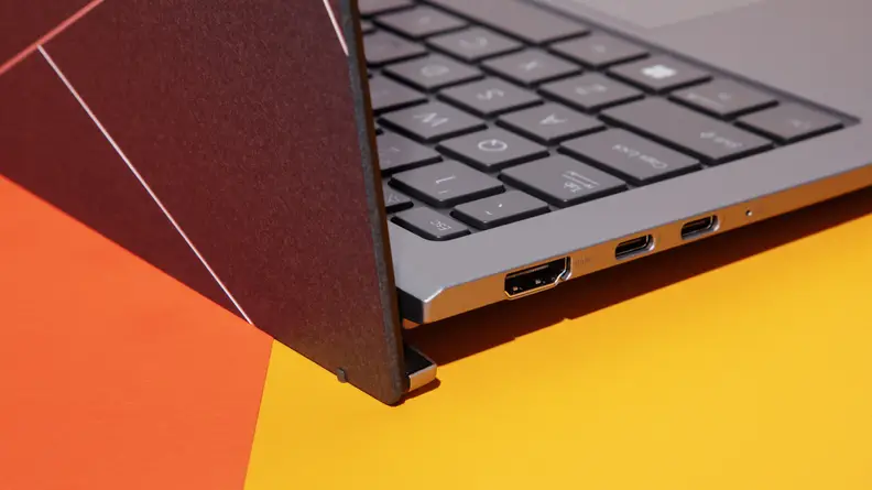 A close up of the side of a laptop that shows the lid open