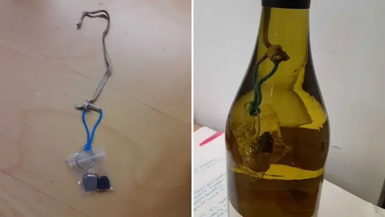 A temperature probe was lowered into wine bottles to measure wine temperature.