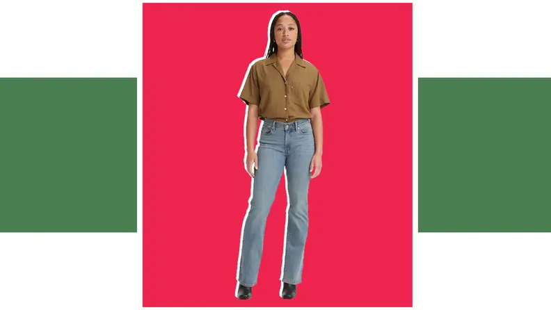 A model wears a brown shirt and gray-blue denim jeans.