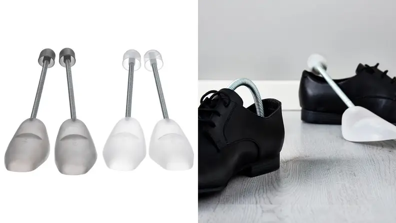 grey and white pairs of plastic shoe trees, plastic shoe trees inside of black shoes