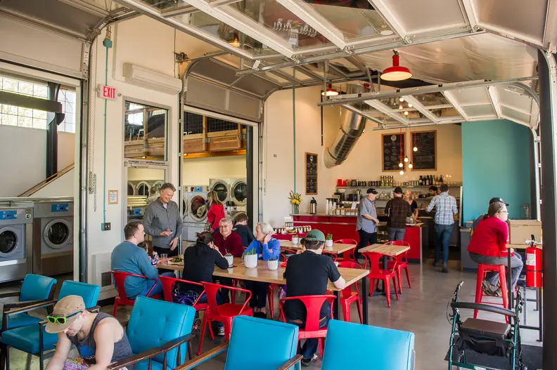 In Portland, Spin Laundry Lounge is a popular destination for food, coffee, and laundry service alike. [Credit: Spinlaundrylounge.com]