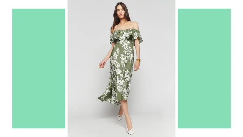 A model wears a green dress with a white floral print.