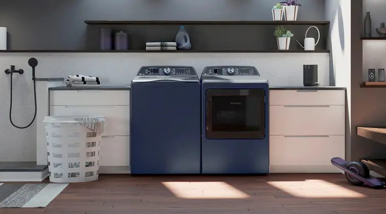 A black washer & dryer pair in a sunny laundry room