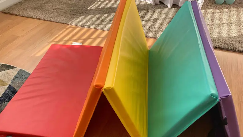 multicolored tumbling mat folded up