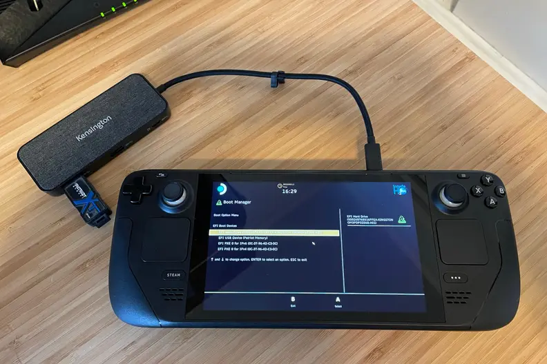 A black handheld gaming console showing part of the Windows 11 OS installation process