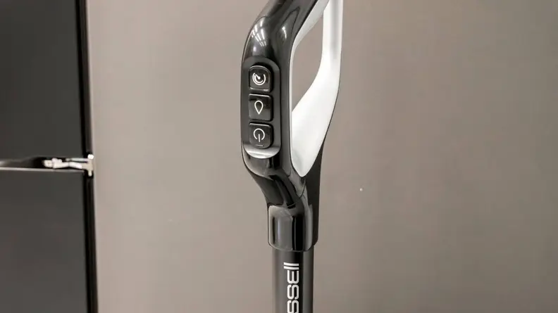 A close-up shot of the function buttons on the Bissell Crosswave Omniforce.