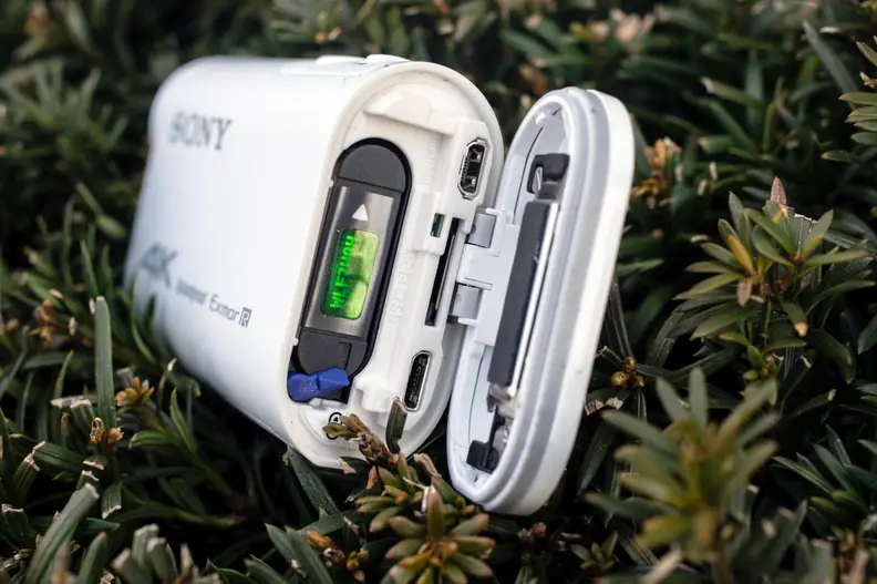 The battery, memory card, and charging port are all located in the rear of the camera, sealed in an airtight bay.