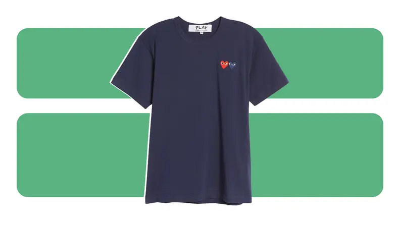 A navy t-shirt with embroidered heart emblems on the chest.