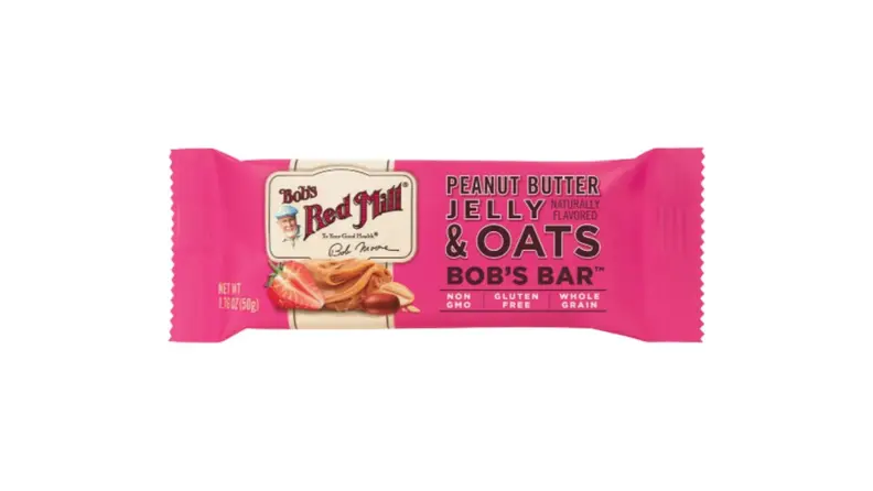 A peanut butter and jelly-flavored granola bar wrapped in a bright pink wrapper.