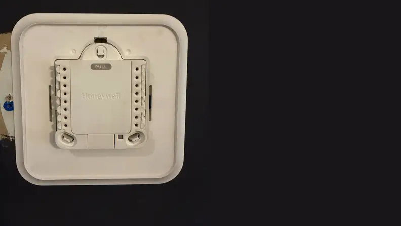 The back of a smart thermostat