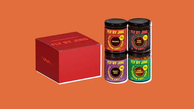 Four small jars of spice samplers from Fly by Jing on an orange background
