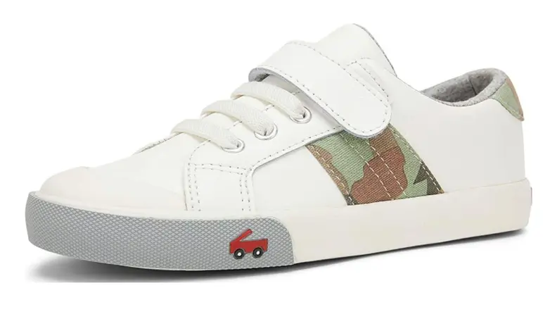 A white sneaker with a camo stripe.