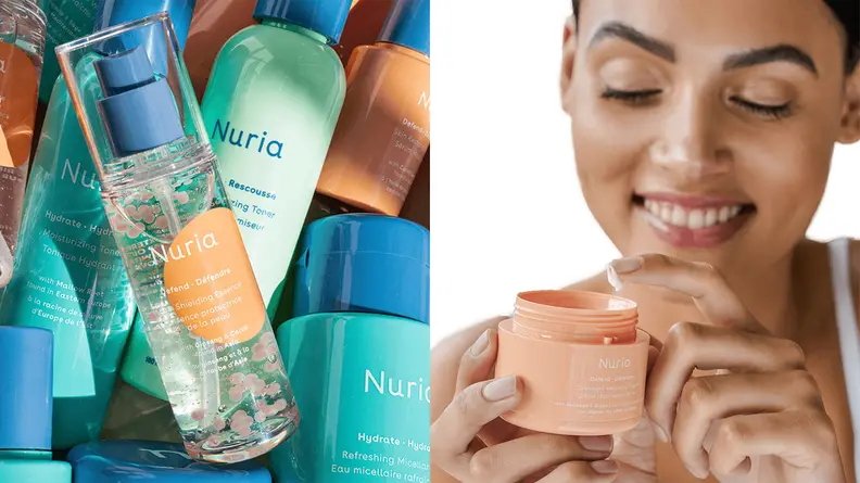 The Nuria Defend Skin Shielding Essence laying on several products from the line.