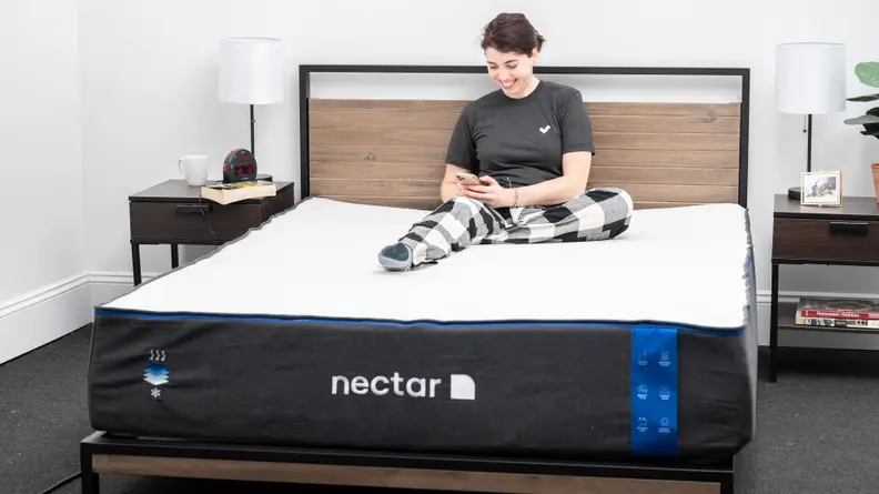 woman reading on bed with nectar mattress