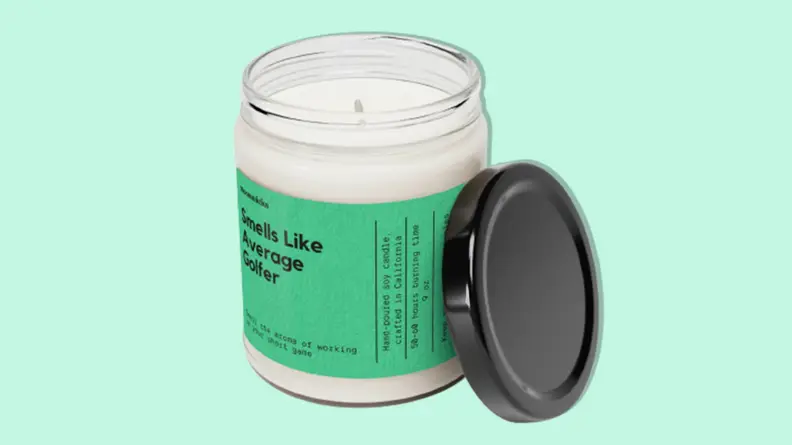 Smells Like Average Golfer Soy Wax Candle on a light green background.