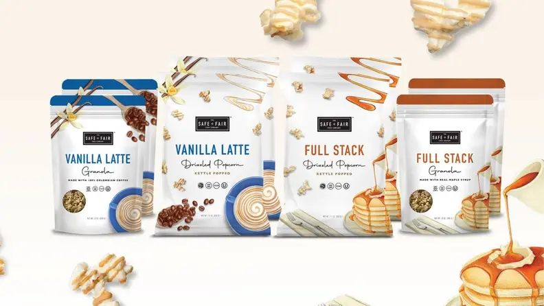An assortment of packaged food items, including pancake-flavored granola and popcorn, and vanilla latte-flavored granola and popcorn.