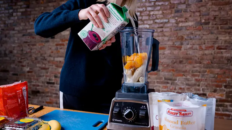 Adding milk to blender