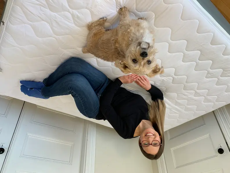 Our tester on the Coleman air mattress with her dog