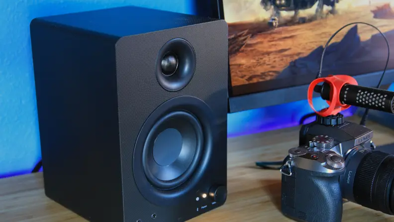 The Monoprice DT-3BT 50-watt desktop speakers on a desktop.