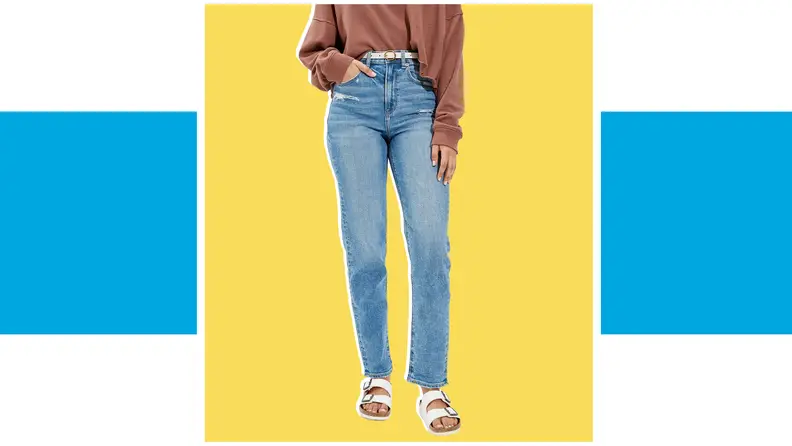 A model wears medium-wash relaxed jeans.