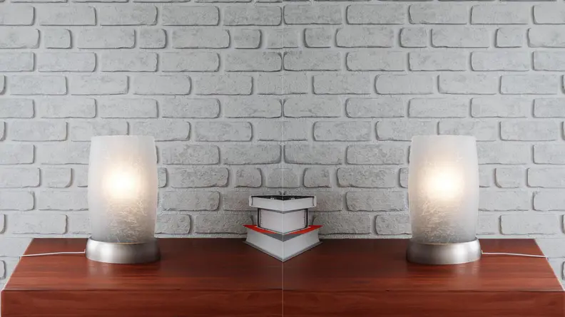 The frosted glass lamp sits on a side table.
